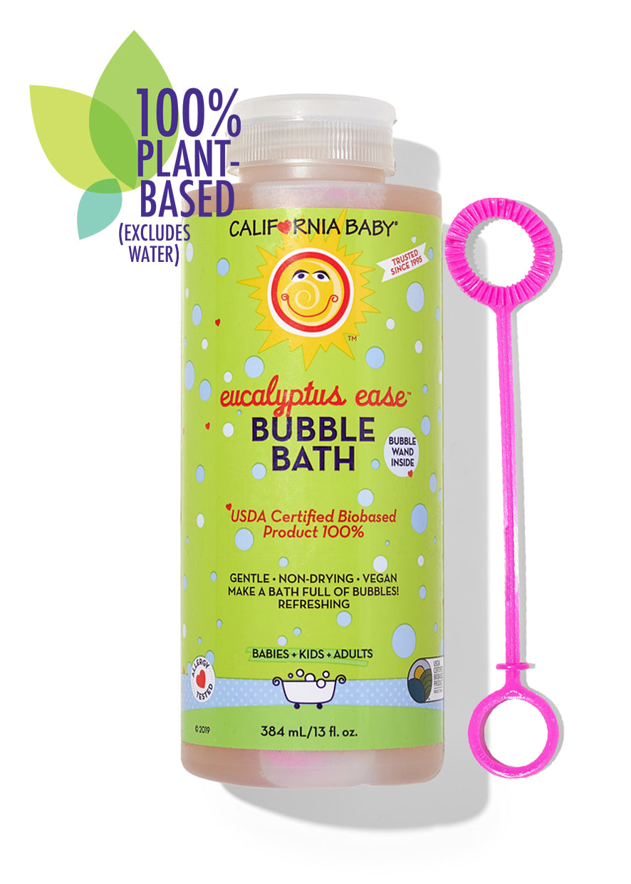 Eucalyptus bubble bath bottle with green label and pink bubble wand accessory