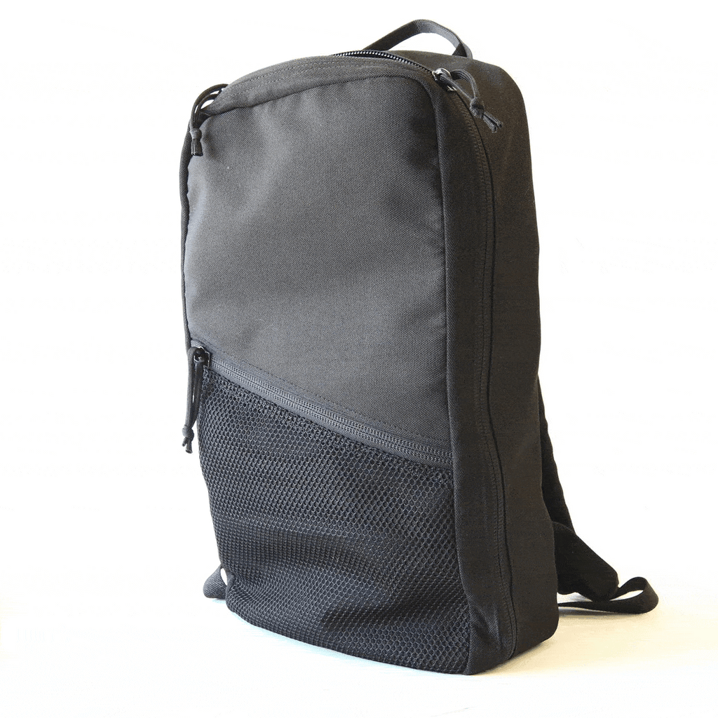 Navy dark minimalist backpack with side zipper and mesh lower panel, plus shoulder strap