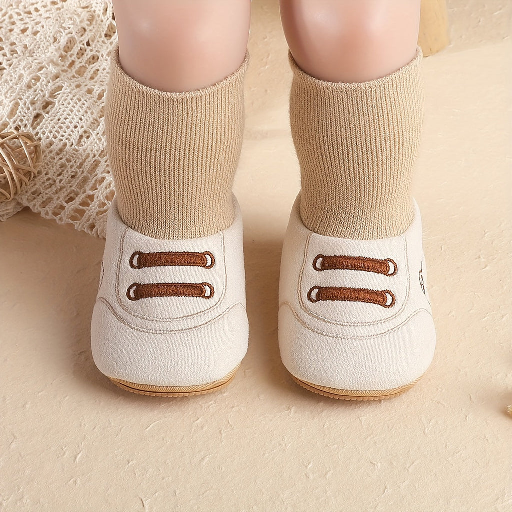 Cream and beige baby sock booties with bear face and stitched lace detail