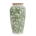 White ceramic vase with green leaf floral pattern and rounded body