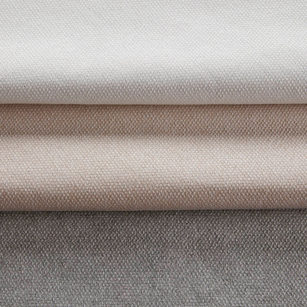 Close-up of layered curtain fabric in white with subtle woven texture