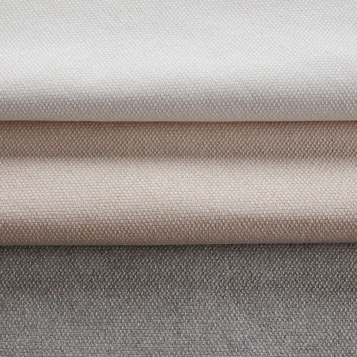 Close-up of layered curtain fabric in white with subtle woven texture