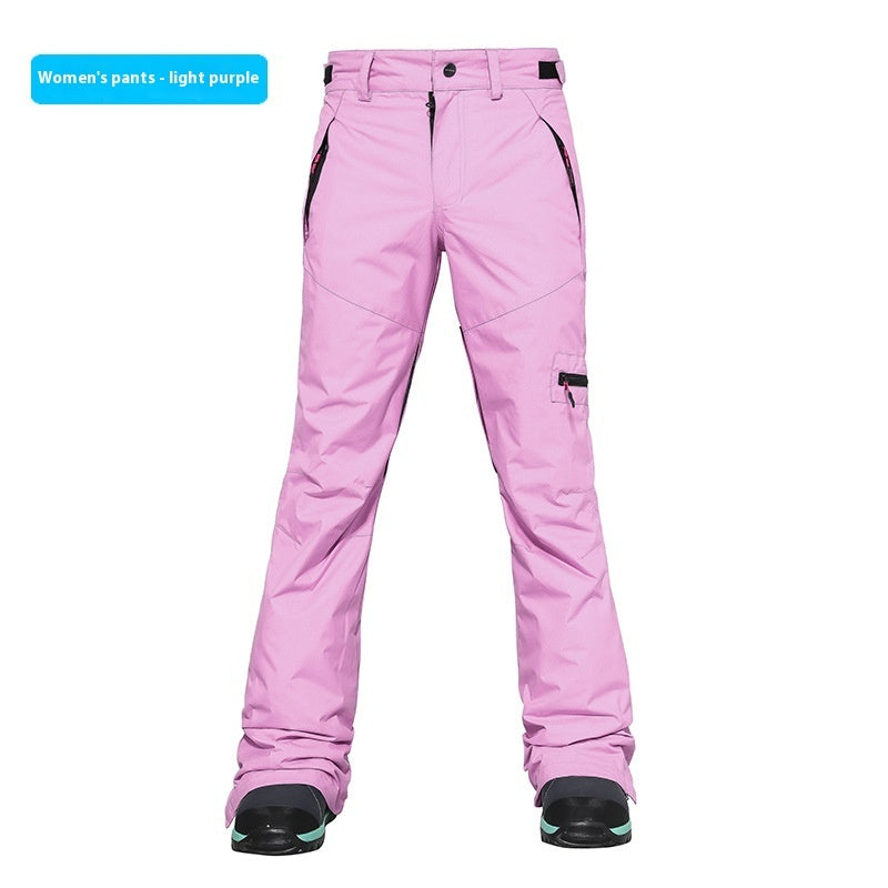 Women's ski pants in light purple, slim fit with zippered side pocket and snow cuffs