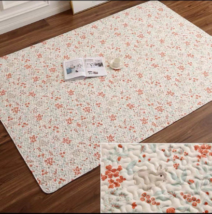 Pure cotton pet mat, cream with small orange floral speckle pattern and stitched edge