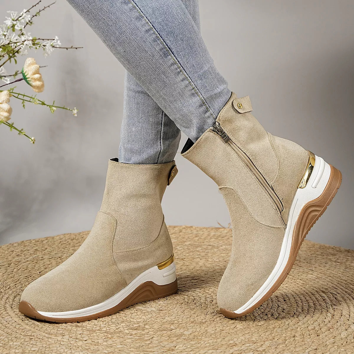 Beige suede ankle boots with wedge heel, side zipper and gold hardware tabs