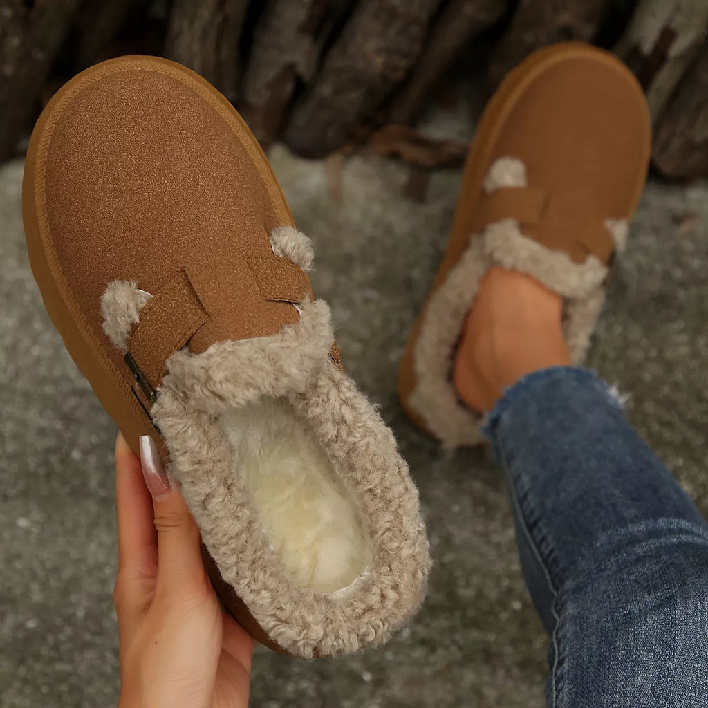 Brown suede-style platform slippers with fuzzy trim and strap buckle detail