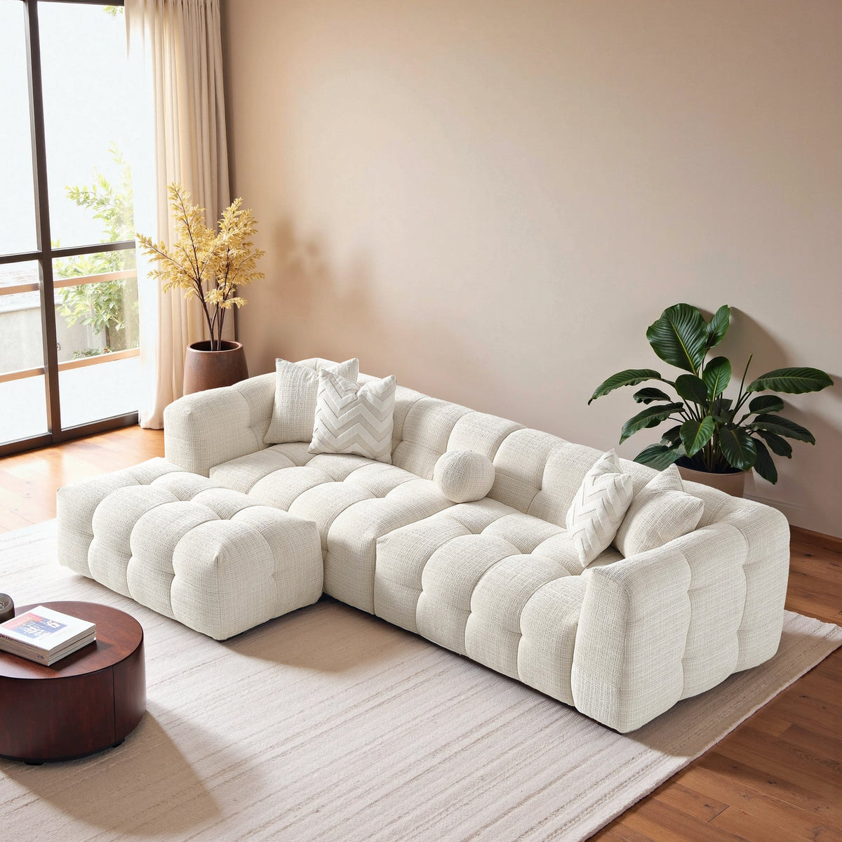 Light fabric tufted modular sectional sofa with rounded back and seat cushions