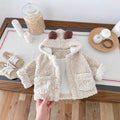 Cream sherpa-style toddler jacket with bear-ear hood and two front pockets