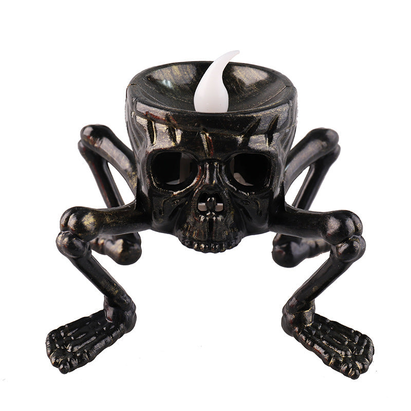 Black skull candle lantern with white candle insert and four metal arms