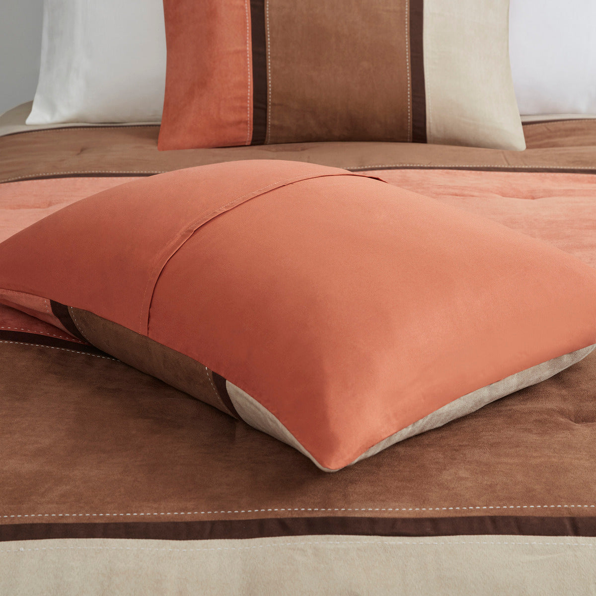 Coral faux suede comforter with brown and cream border stripe