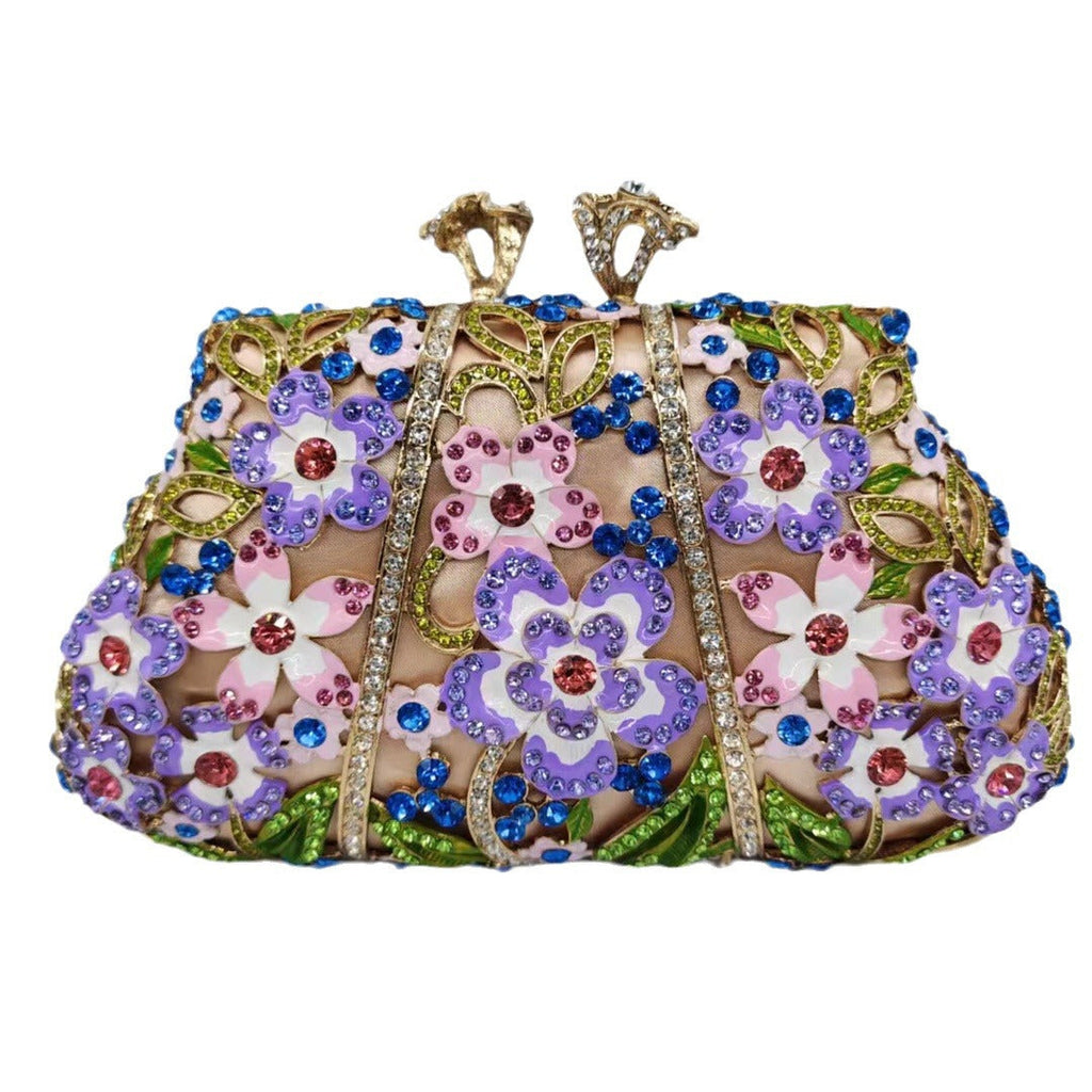 Jeweled floral evening clutch with blue rhinestones, purple flowers, green accents, gold-tone frame