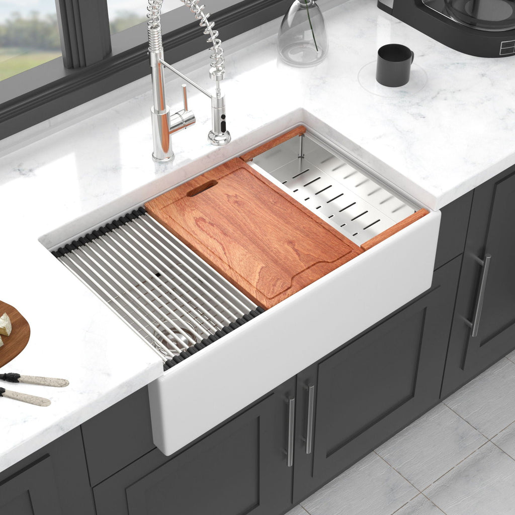 White ceramic double-bowl farmhouse sink with angled wood cutting board and ribbed ledge