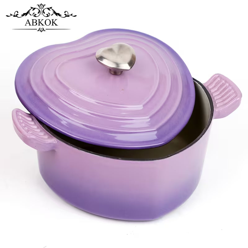 Purple enamel cast iron Dutch oven with glossy round lid and heart-shaped metal knob