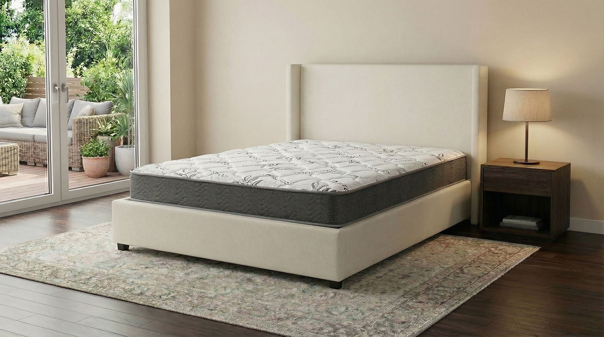 Queen firm foam mattress on beige platform bed with white quilted cover