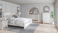 White panel bed with upholstered headboard and footboard