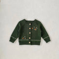 Infant dark green knit cardigan with contrast trim and button front, embroidered icons on chest