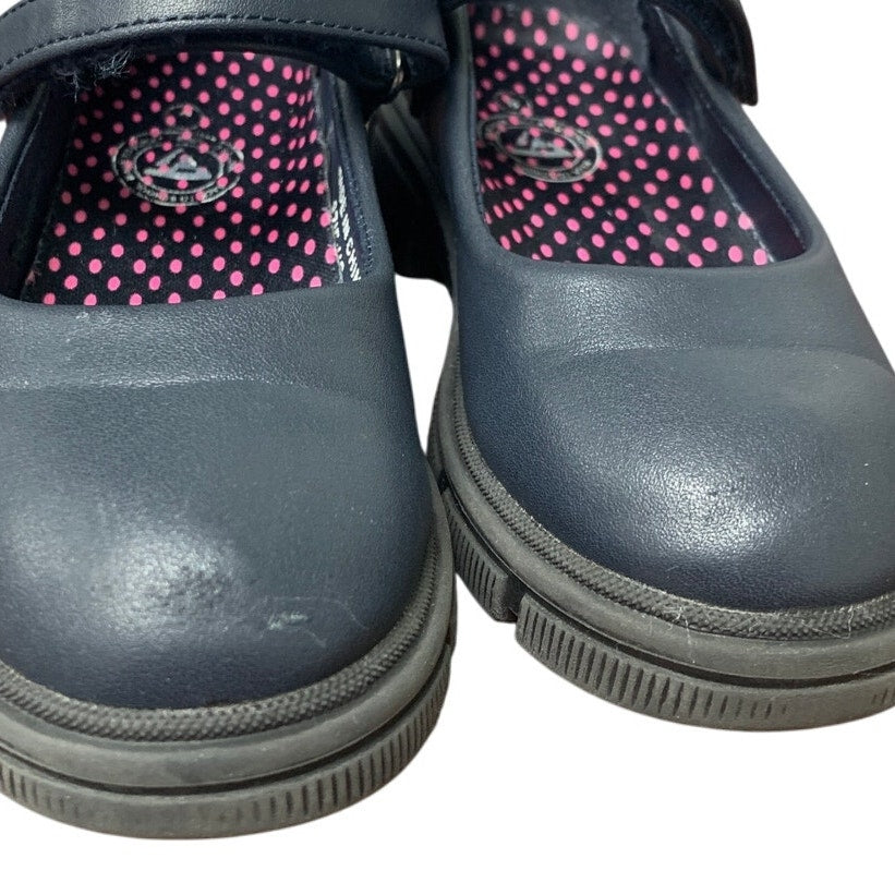 Navy toddler Mary Jane shoes close-up: hook-and-loop strap and pink dot lining