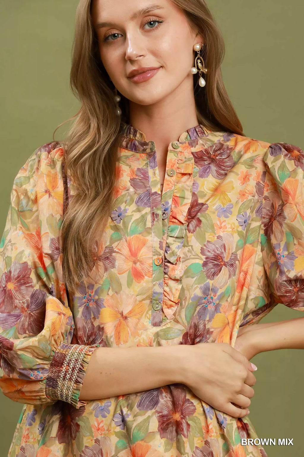 Close-up of floral button-front dress with gathered neckline, brown mix