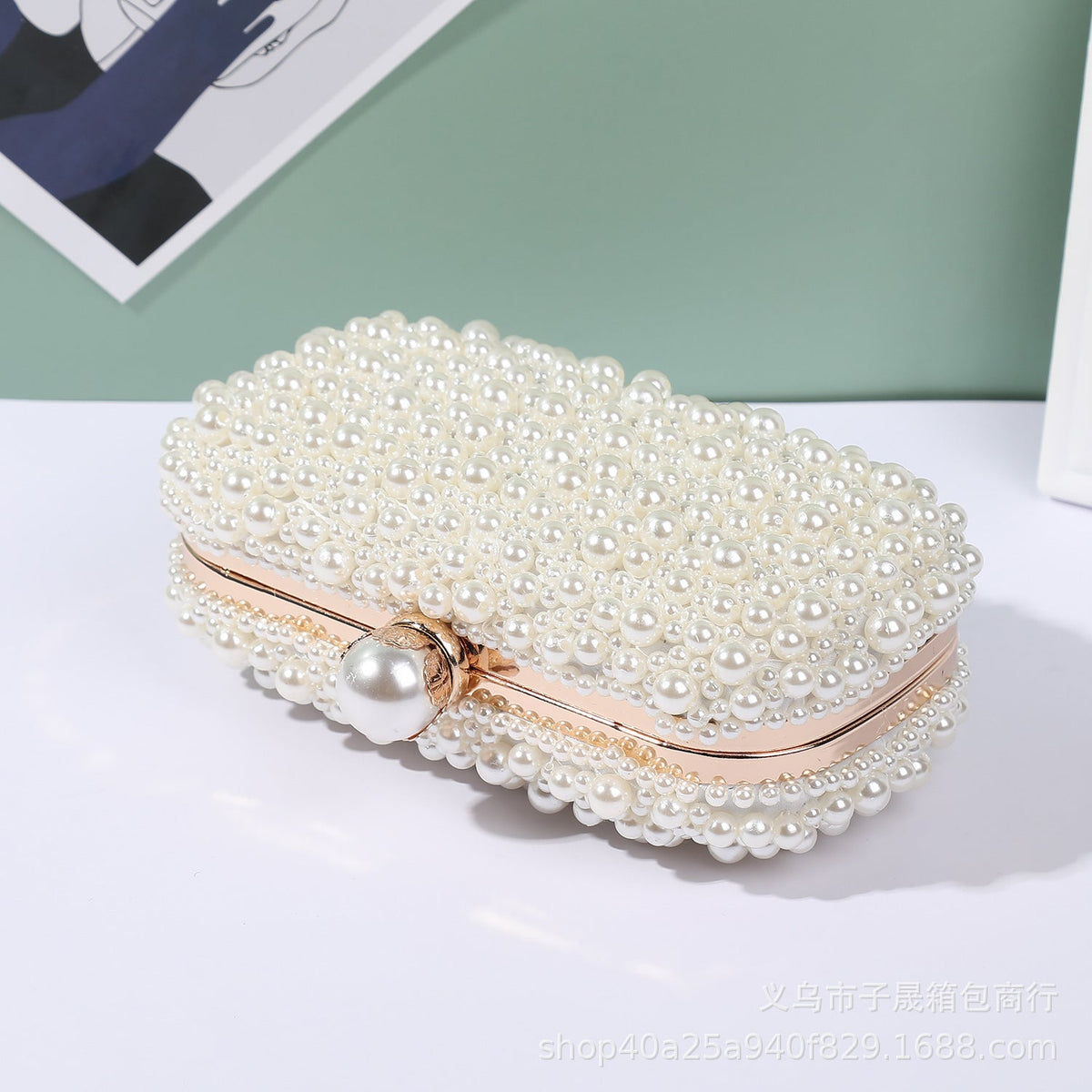 White pearl bead lock clutch with gold-tone frame and round clasp, side view