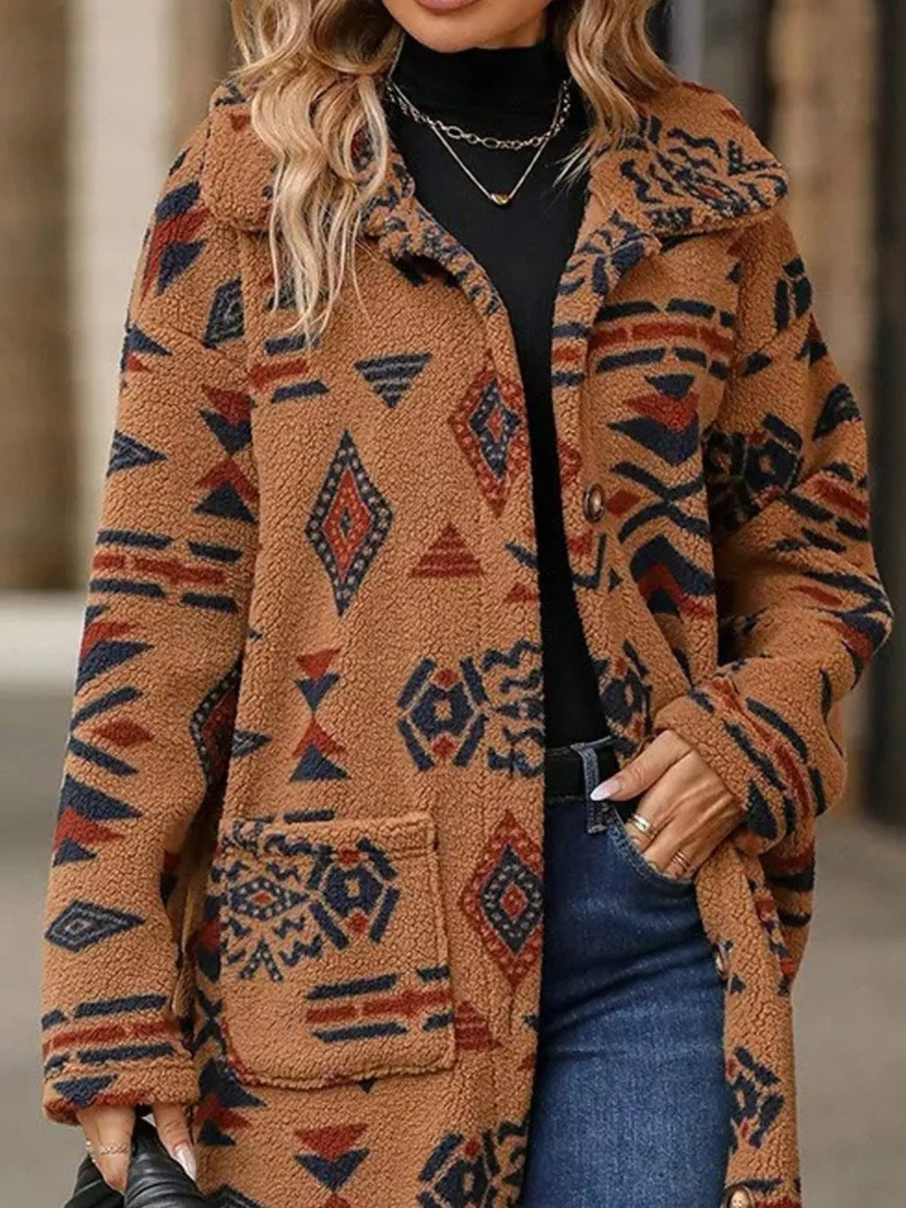Geometric longline button-up coat in tan-brown with rust and navy motifs, button placket.