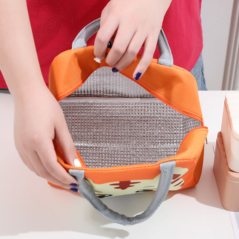 Orange cartoon lunch cooler bag held open, showing gray mesh insulated interior