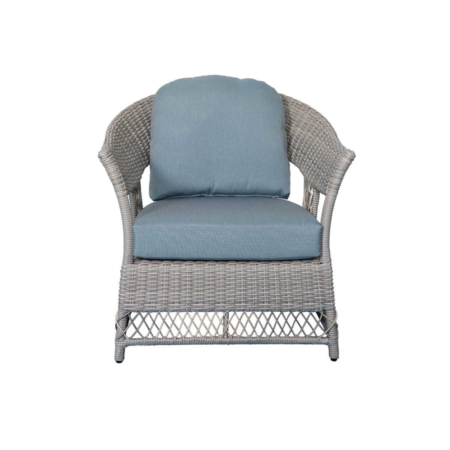 Stationary wicker lounge chair with light blue seat and back cushions