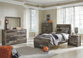 Youth panel bedroom set with gray wood-look bed, dresser with mirror, and bedside nightstand