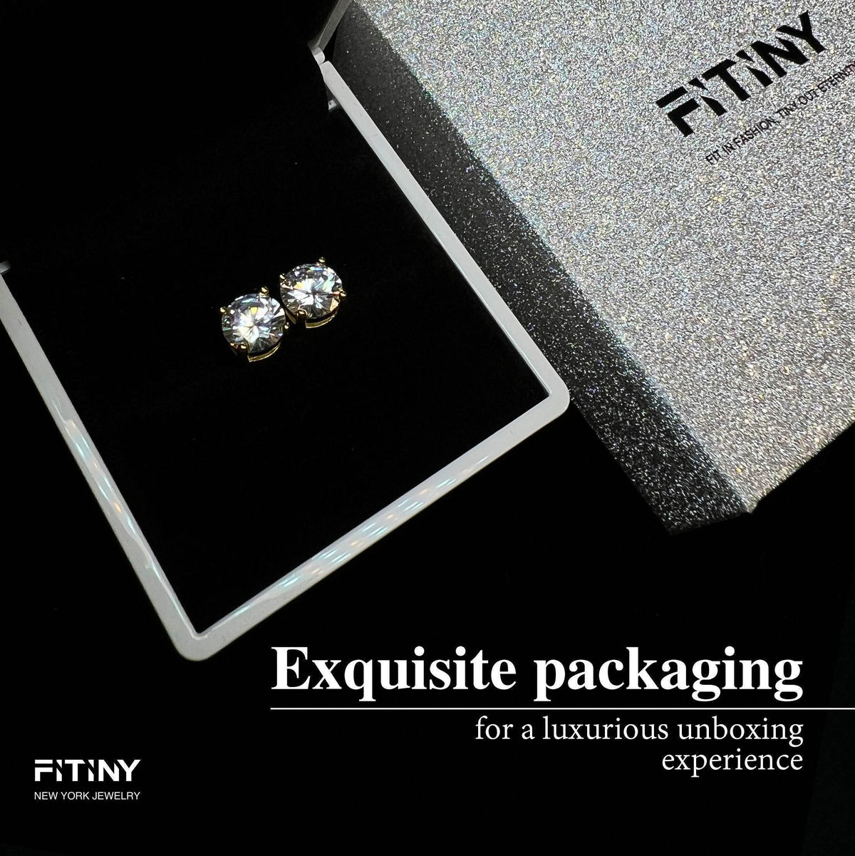 Earring jewelry box with glitter finish holding a gold zirconia stud.