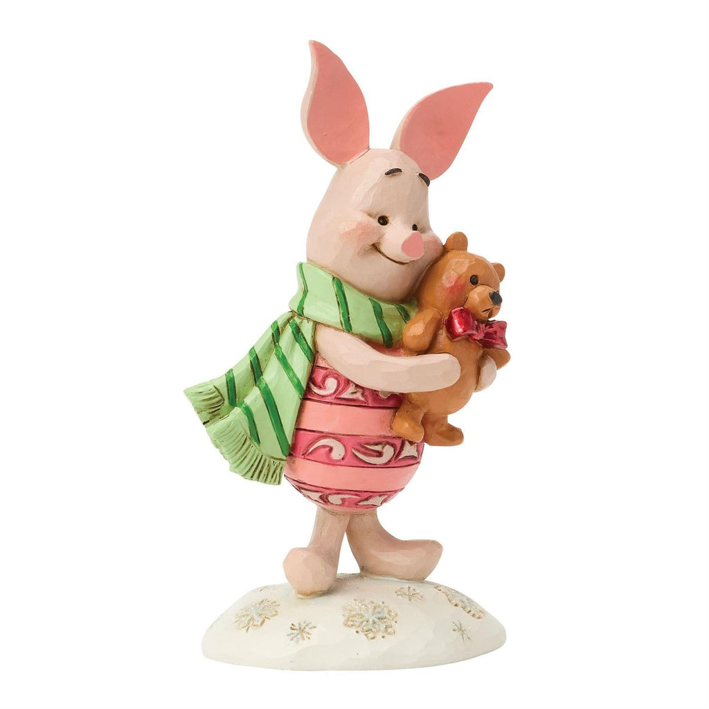 Piglet mini figurine hugging teddy bear, front view, green scarf and pink dress
