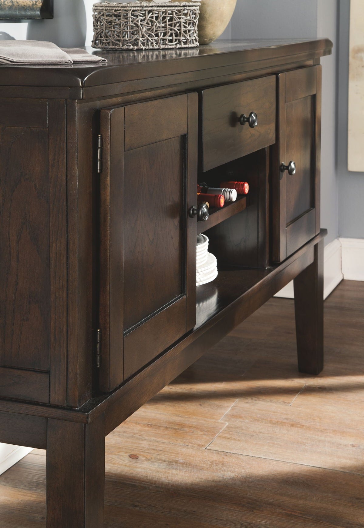 Dark brown dining table with cabinet doors and drawer pulls