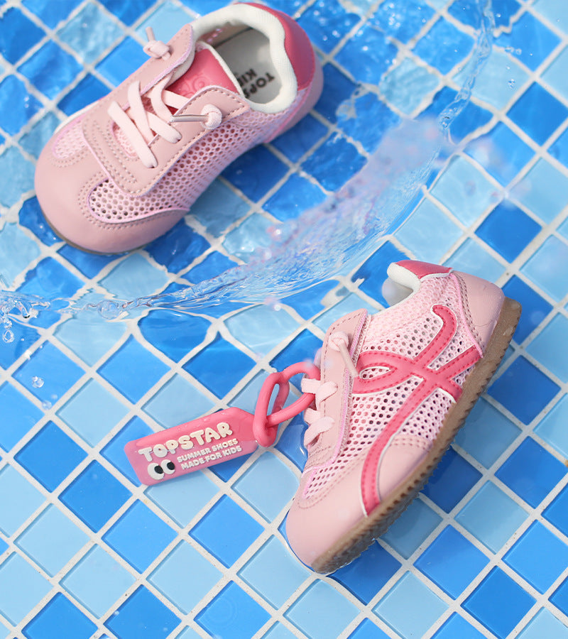 Pink toddler lace-up sneakers with red side logo and blue trim