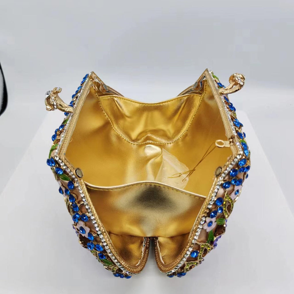 Gold satin interior of beaded evening clutch with jeweled blue edge trim