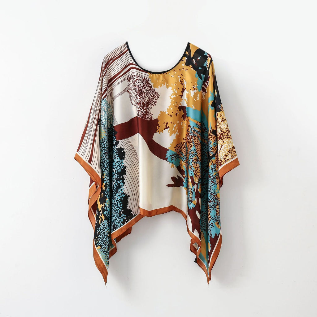 Maroon, teal, and orange abstract wrap poncho shawl with fringe hem and round neck