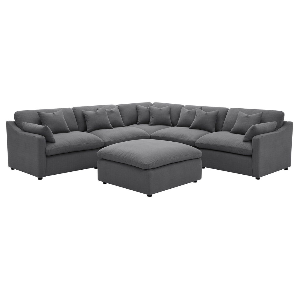 Charcoal modular sectional sofa with curved chaise corner and ottoman