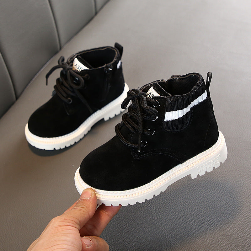 Black lace-up ankle boots with white striped collar and white rugged sole