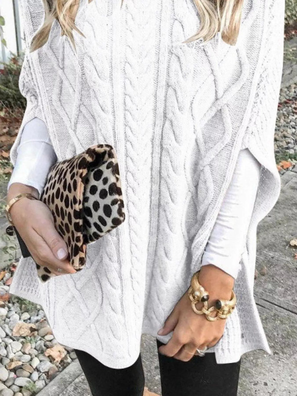 White cable-knit turtleneck poncho cover-up with open-knit drape and cable texture