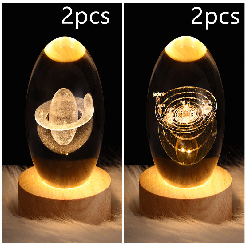 LED galaxy crystal ball lamp with floating planet and glowing ringed designs; wooden base