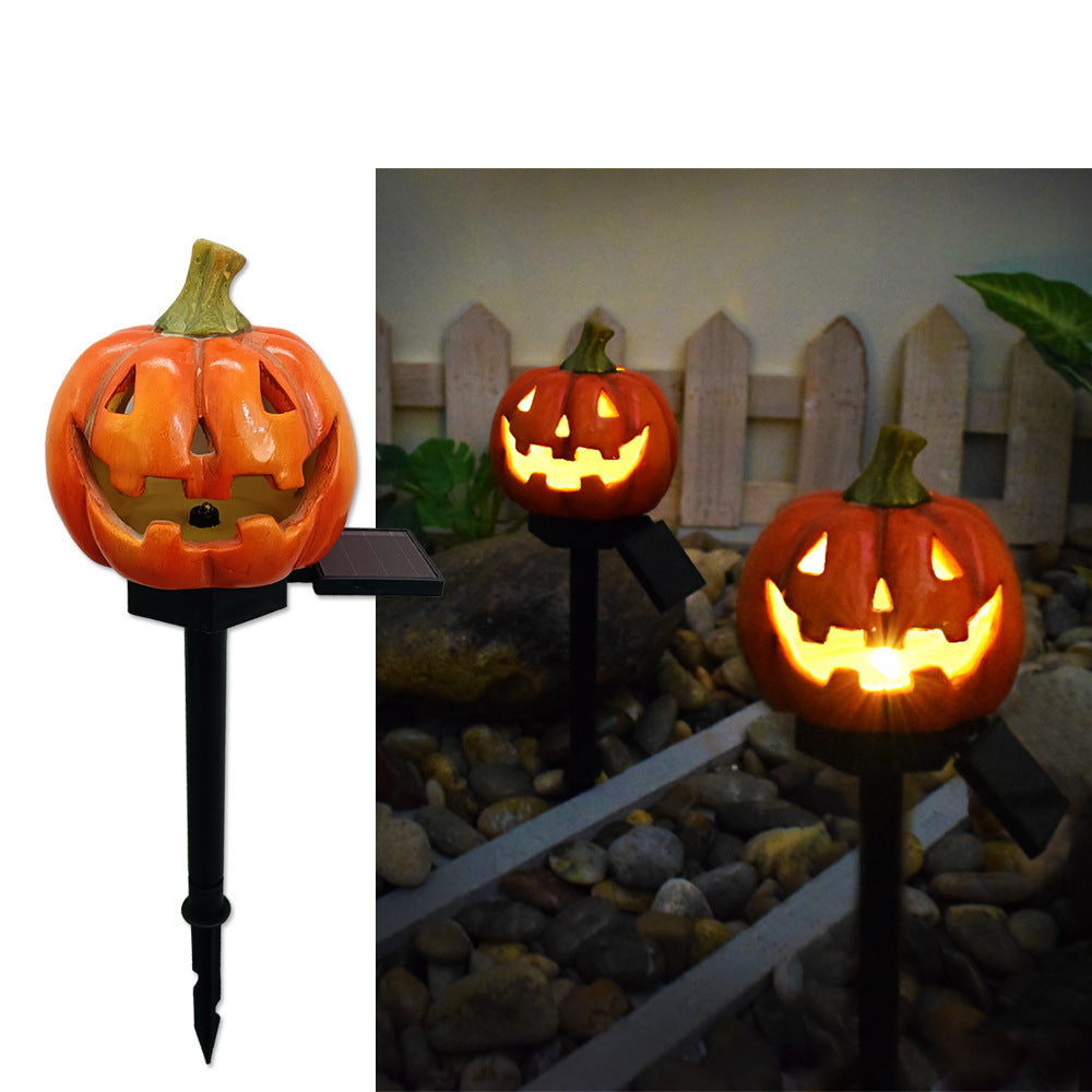 Solar Halloween pumpkin lantern stake lights with carved jack-o’-lanterns glowing orange