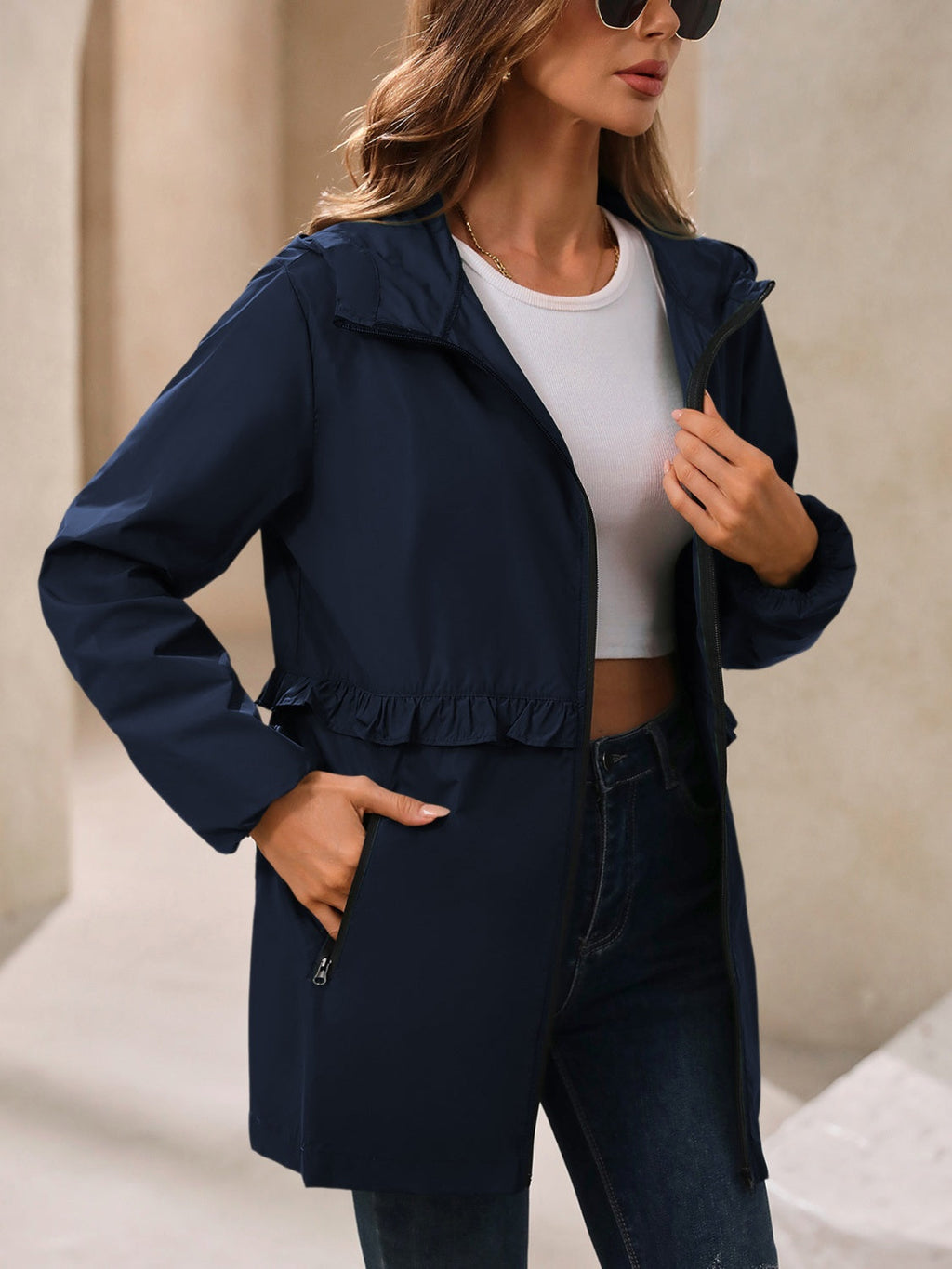 Navy hooded windbreaker jacket with full zip front and gathered waist