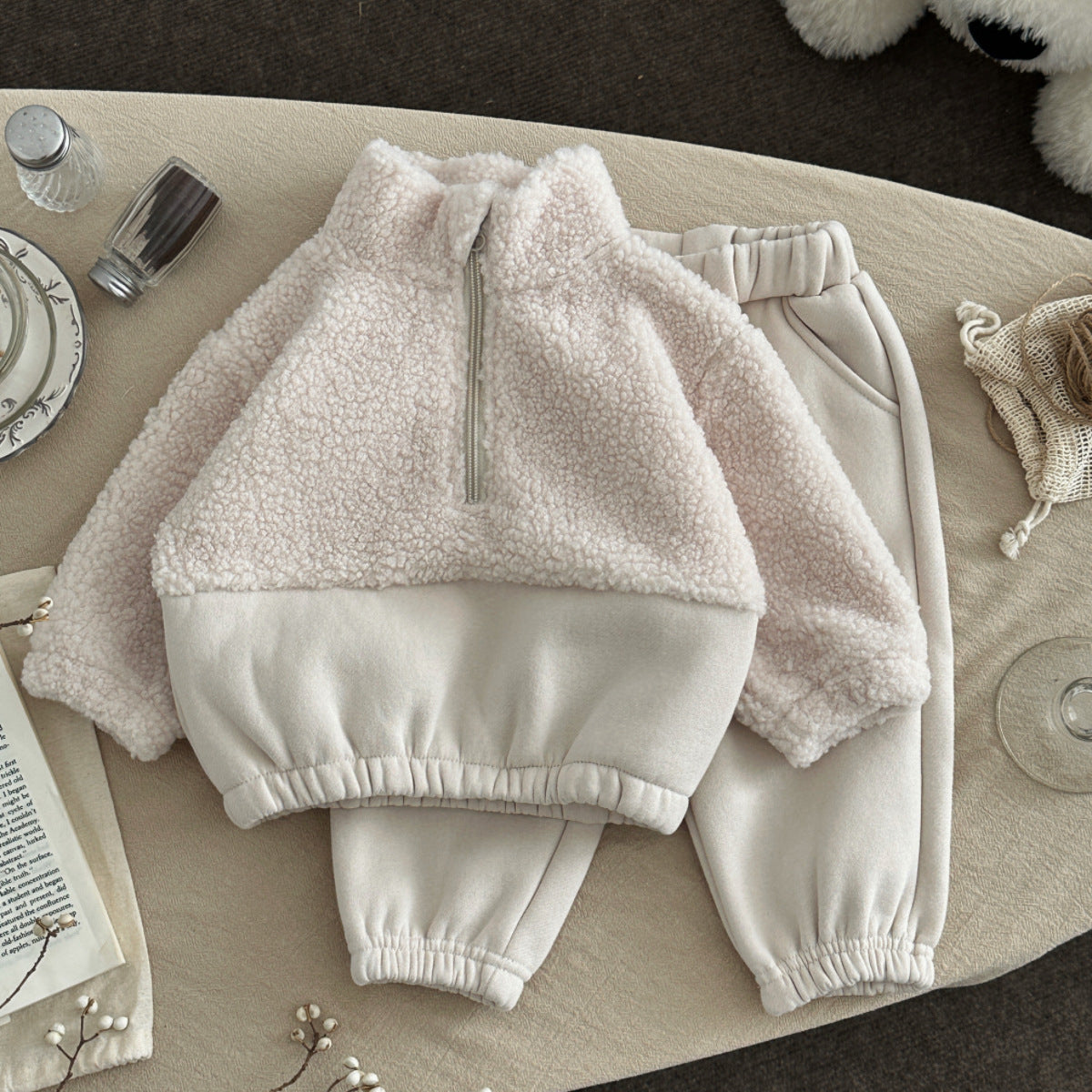Fuzzy light beige baby half-zip stand-up collar sweater, folded with sleeves