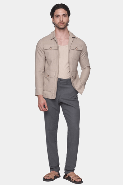 Men's slim safari coat in natural beige, front three-quarter view with flap pockets and buttons