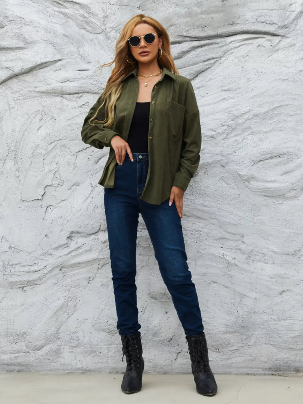 Olive corduroy button-front shirt worn with dark jeans and black ankle boots