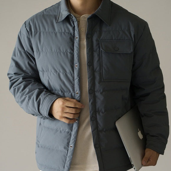 Men's short puffer jacket in gray with baseball collar, button front, and chest pocket