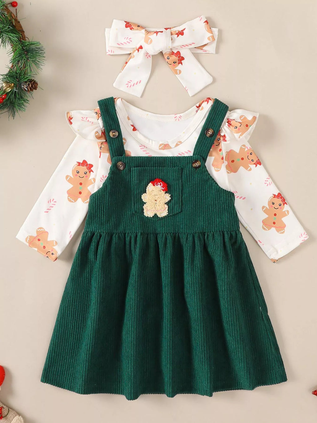 Green corduroy overall dress with reindeer applique over gingerbread print bodysuit