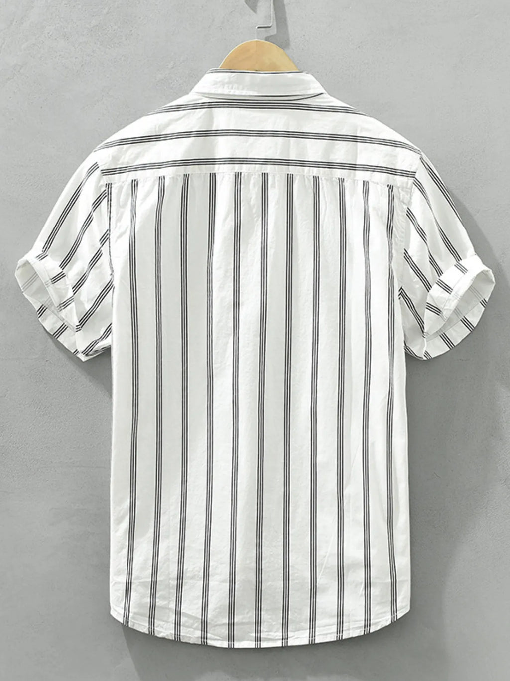 Plus-size striped short-sleeve button-up shirt, white with vertical black stripes, back view