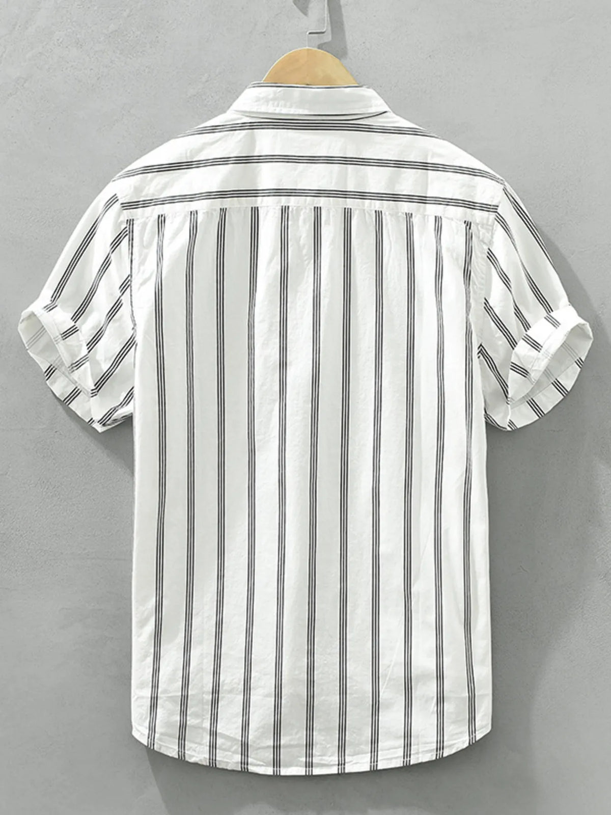 Plus-size striped short-sleeve button-up shirt, white with vertical black stripes, back view