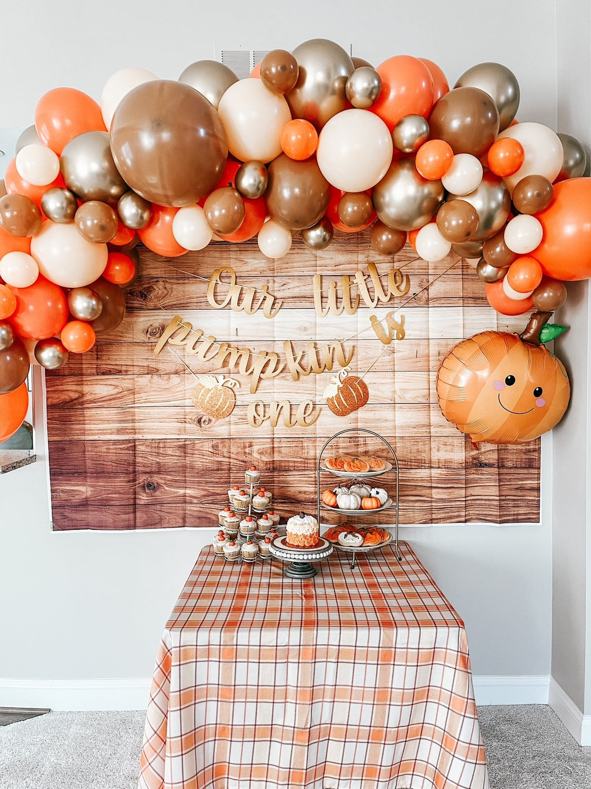 Woodland fall balloon garland kit with orange, tan, white and metallic balloons plus pumpkin sign