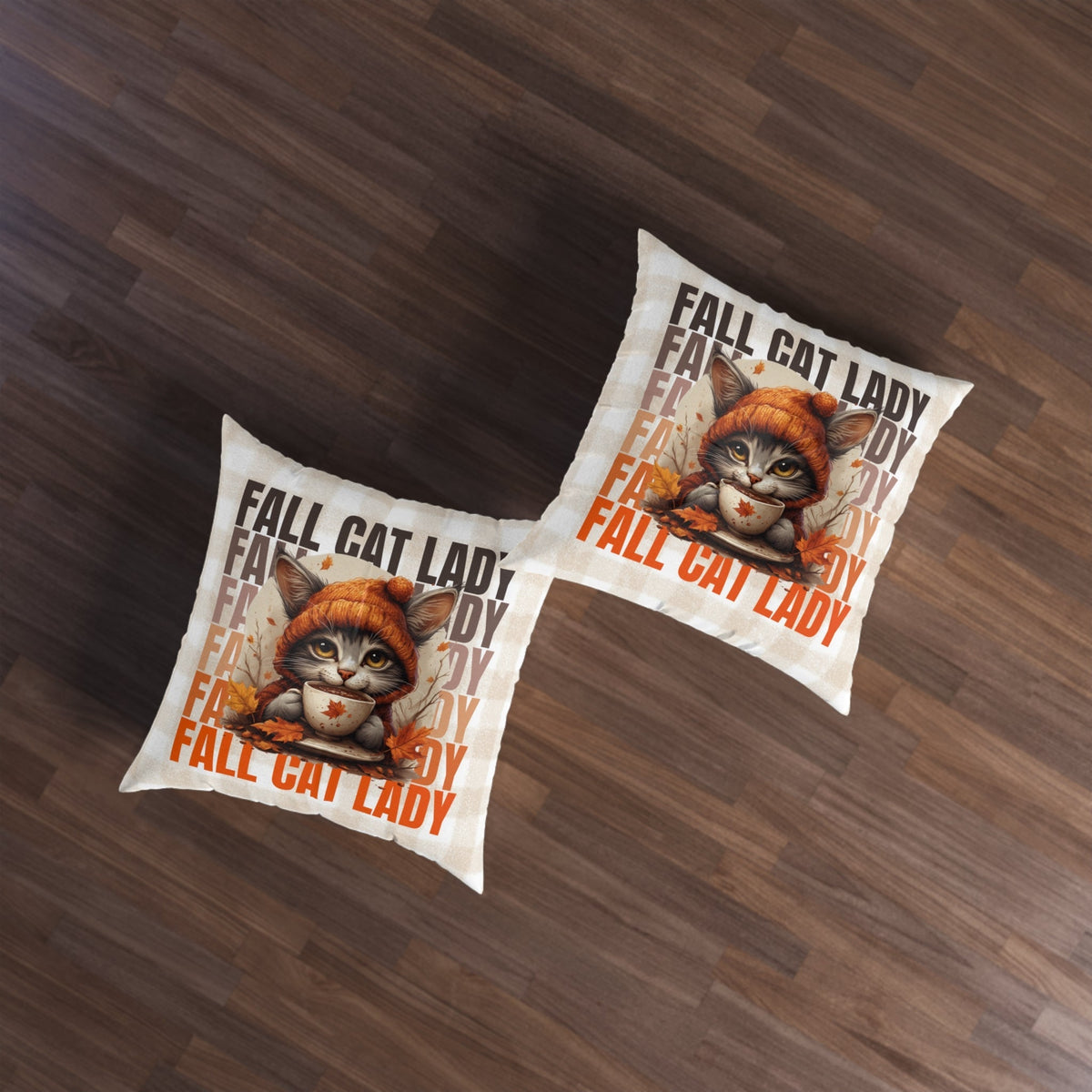 Two tufted floor pillows from above, orange cat with cup and leaves, bold 'FALL CAT LADY'