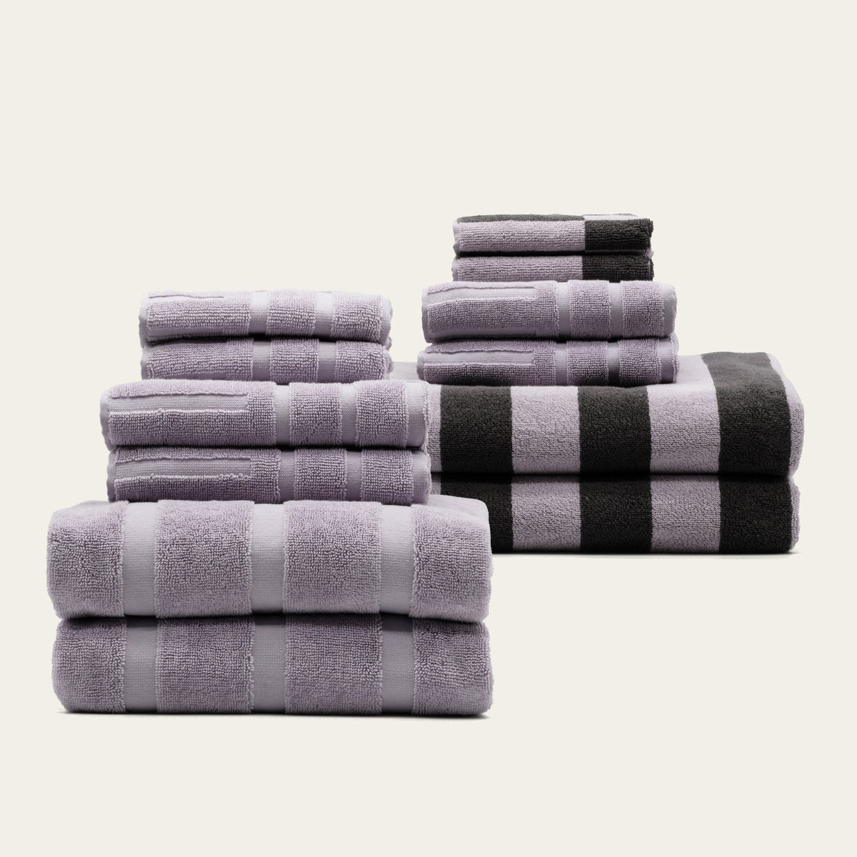 Cotton towel set with lavender towels and black-and-white striped bath towel