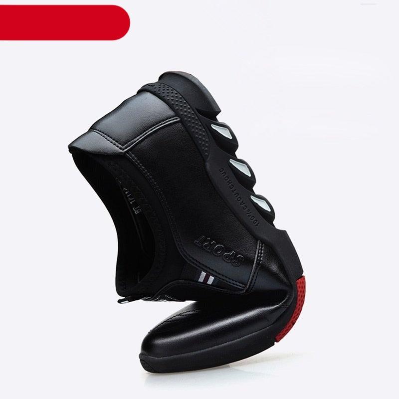 Black leather slip-on sneakers with padded collar and textured rubber outsole